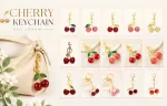 Mini bubble textured red cherry keychain with single gold leaf, dreamy soft sweetness follows you on every outing