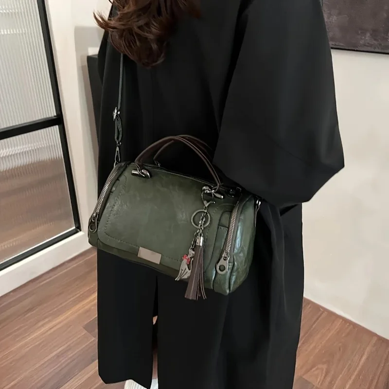 Vintage Tote Bag: Spacious multi-pocket design with tassel and metal accents, supports multiple carrying methods, combining practicality and style..light brown